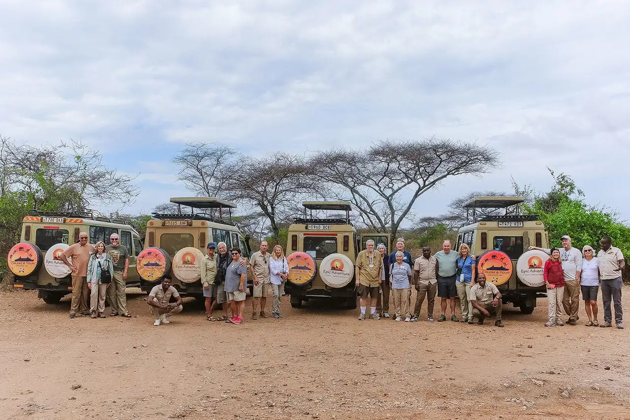 Epic Adventure guests with our safari vehicles
